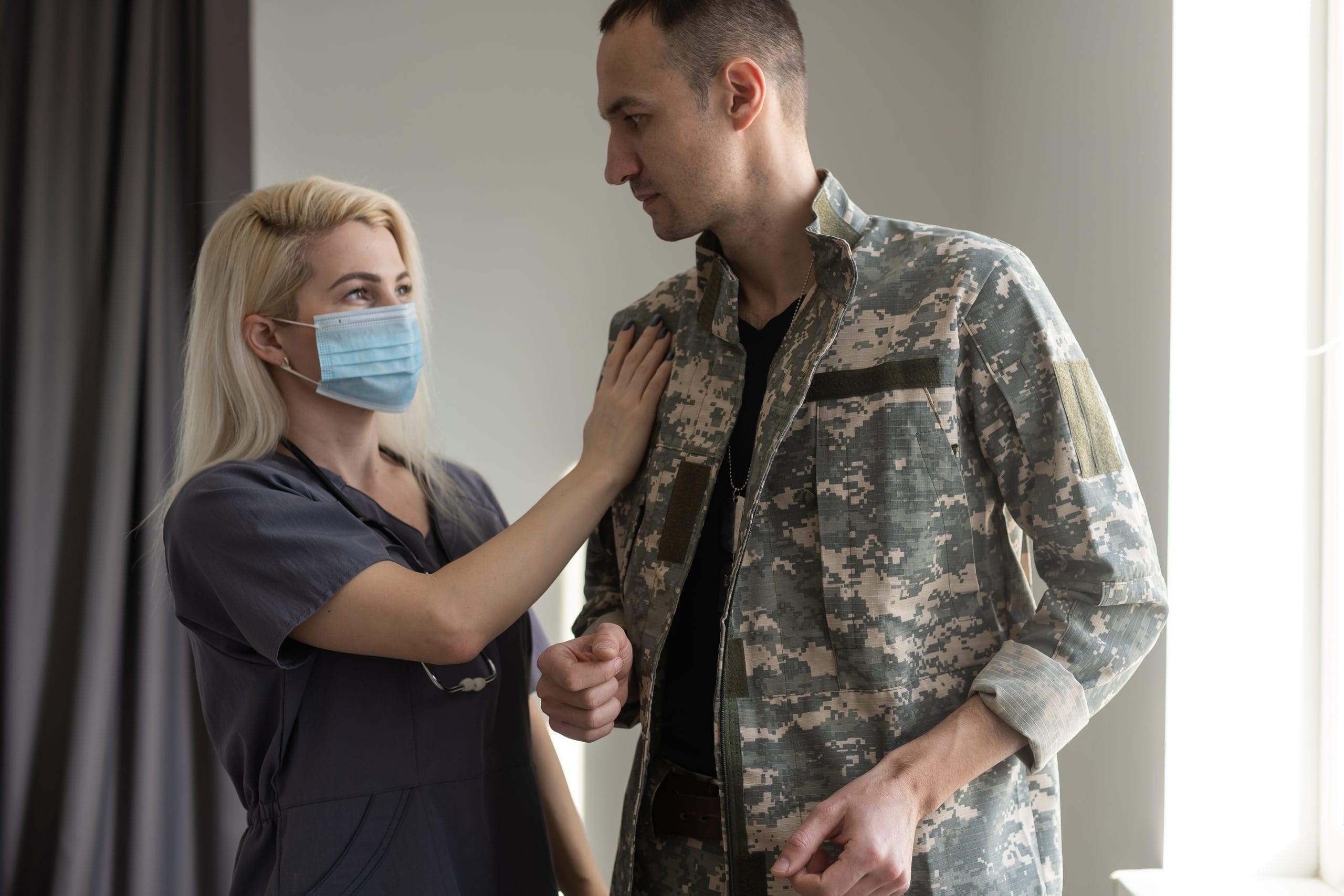 Caregiver assisting a U.S. military veteran at home in Fort Myers, Florida through the VA Community Care Network