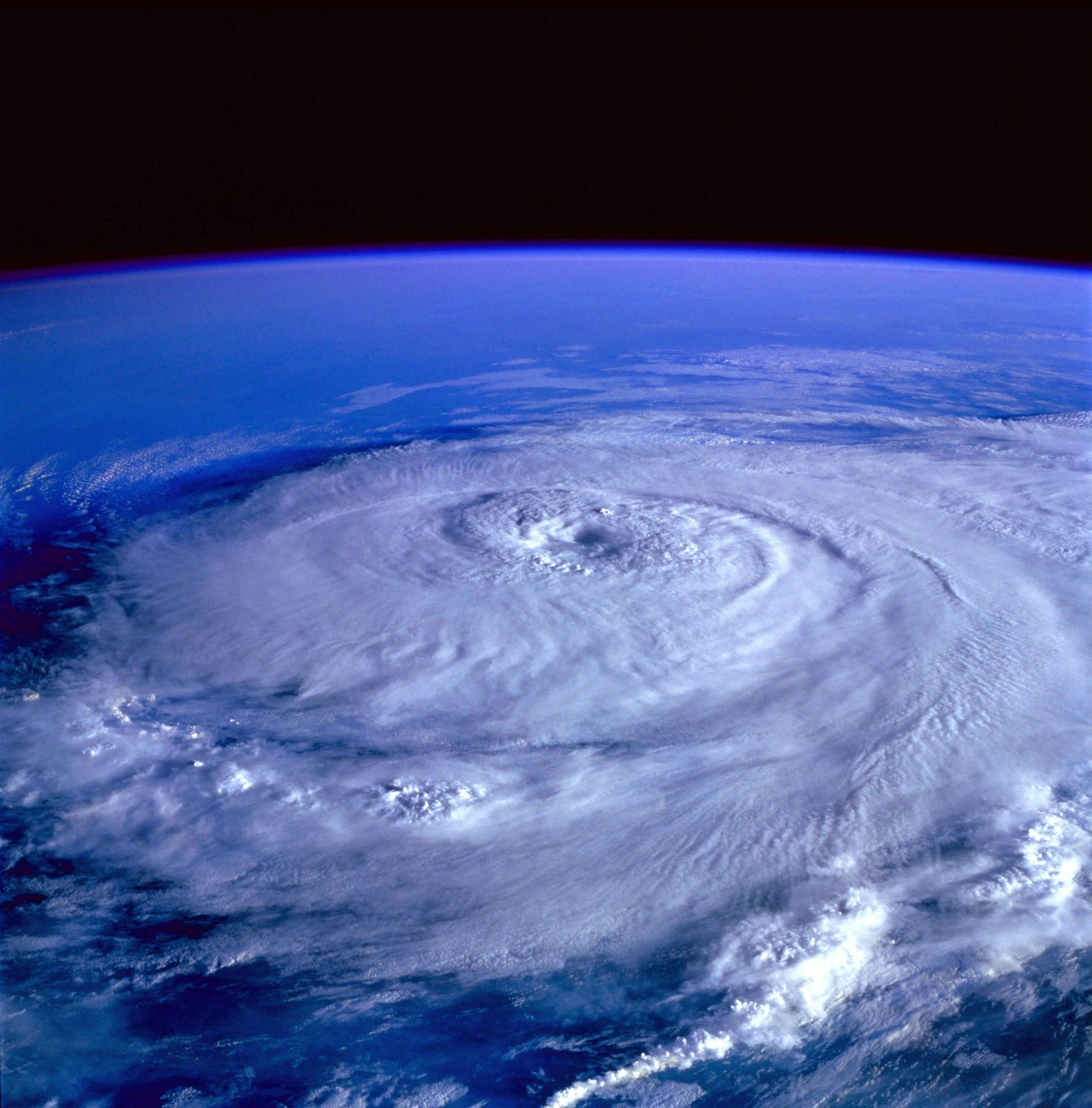 Hurricane season prep for Southwest Florida seniors: satellite view of a swirling storm over the ocean, illustrating the 2026 Atlantic hurricane season threat