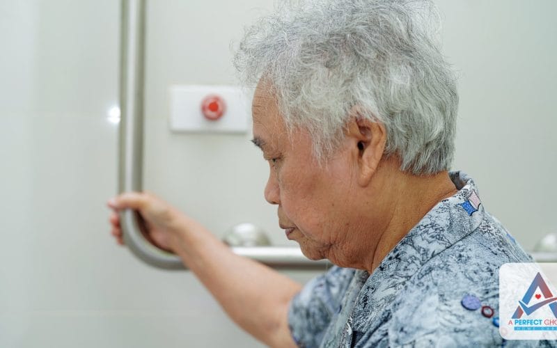 Senior woman using a bathroom grab bar at home for fall prevention
