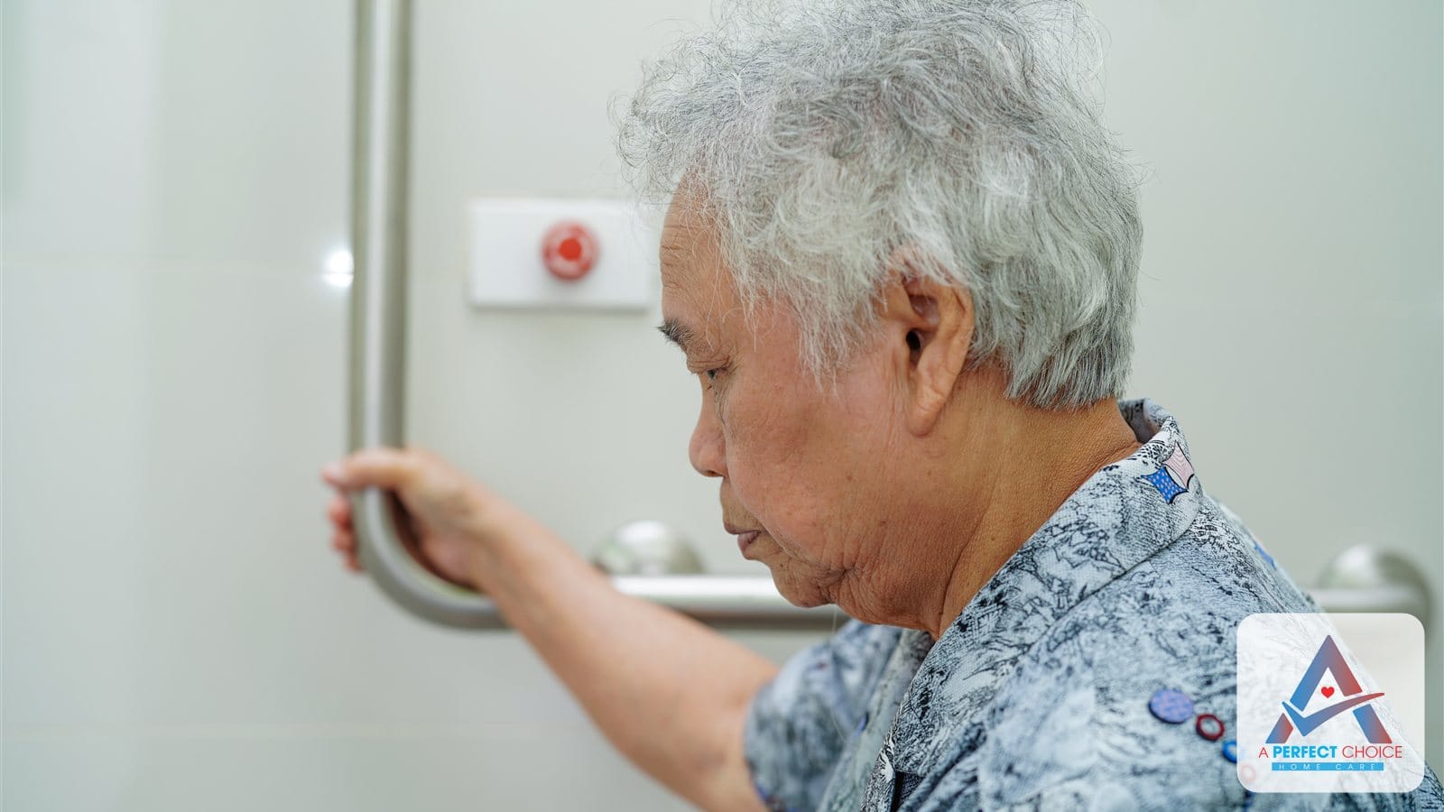 Senior woman using a bathroom grab bar at home for fall prevention