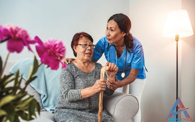 Companion caregiver checking on an elderly woman with a walking cane in her Southwest Florida living room
