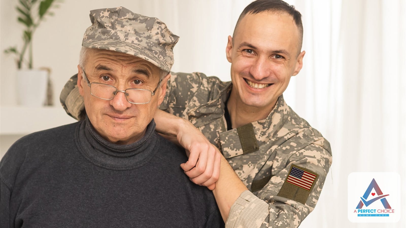 Senior veteran in a camouflage cap with his adult son smiling at home